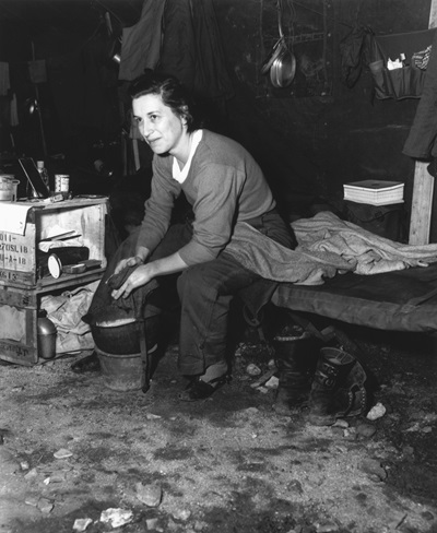 Army captain uses her helmet as a wash basin during the Korean War