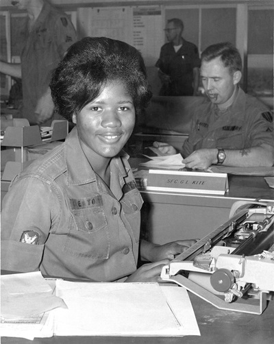 Member of the Women's Army Corps types correspondence during the Vietnam War